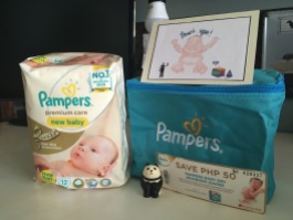A pack of Pamper's newborn diapers in a cute tote (which is now Squishy's first aid kit).
